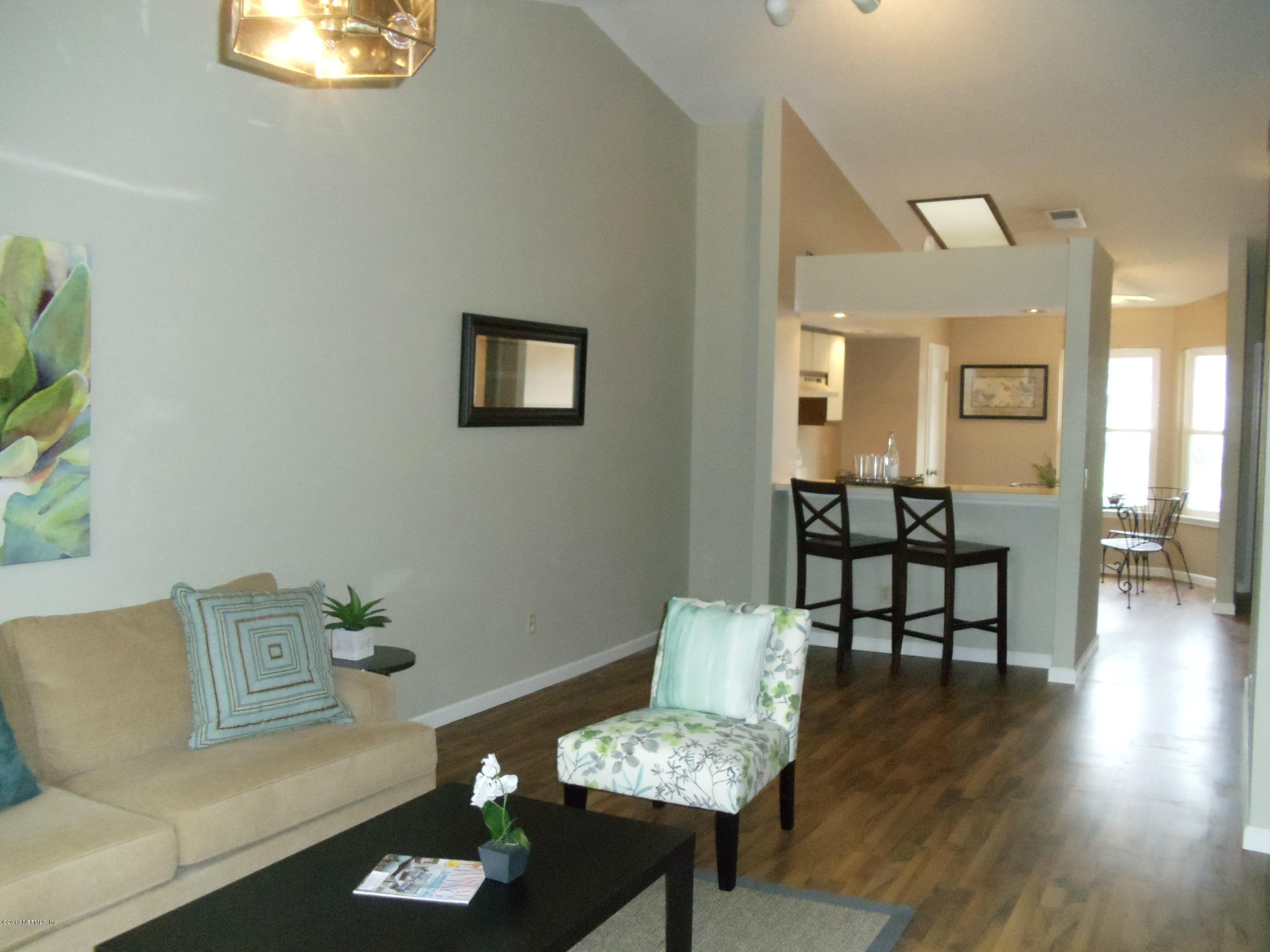 2462 Wattle Tree Road East Jacksonville, FL 32246 - Photo 5 of 35 a living room with furniture and wooden floor
