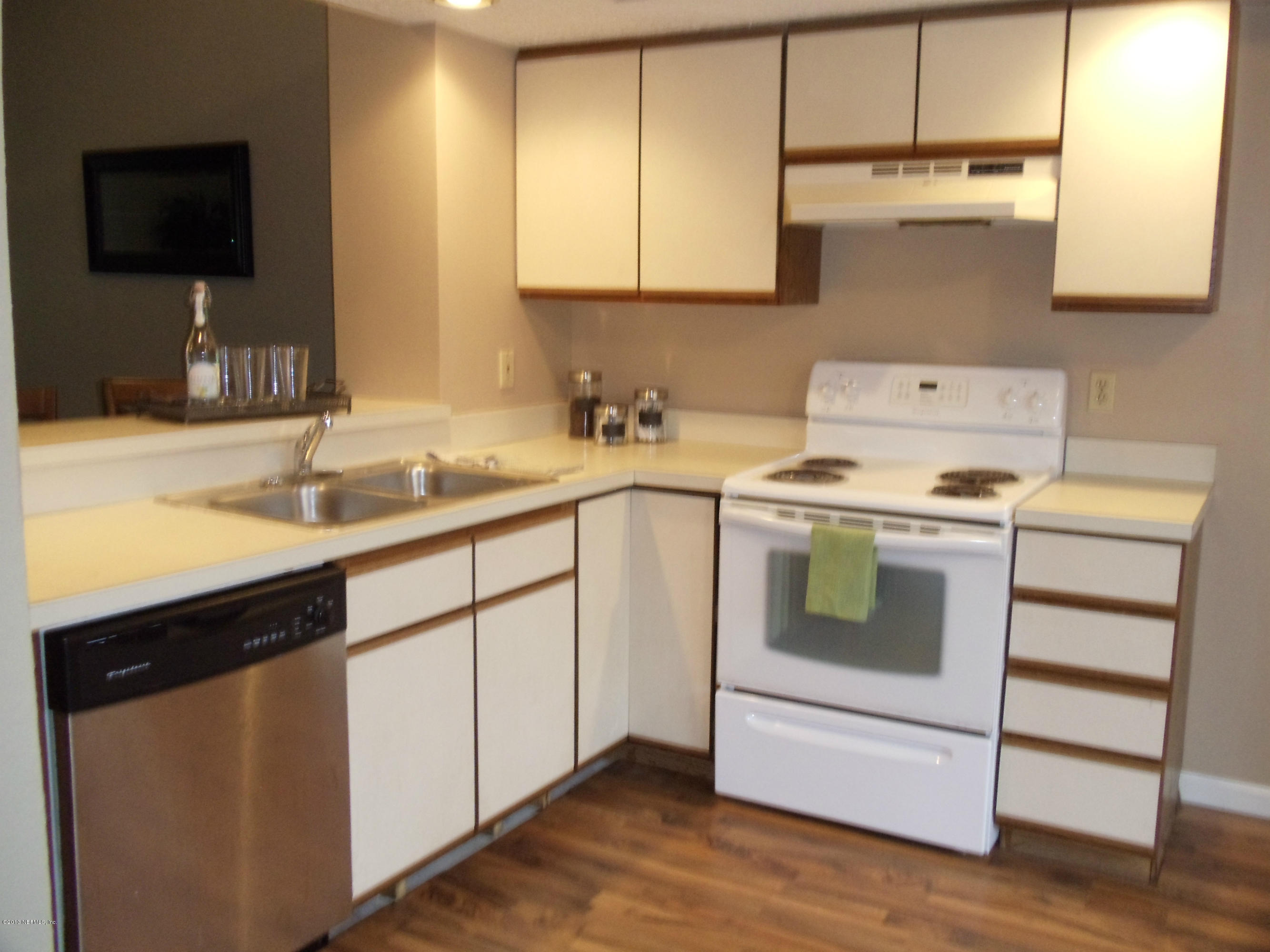 2462 Wattle Tree Road East Jacksonville, FL 32246 - Photo 7 of 35 a kitchen with a sink stove and cabinets