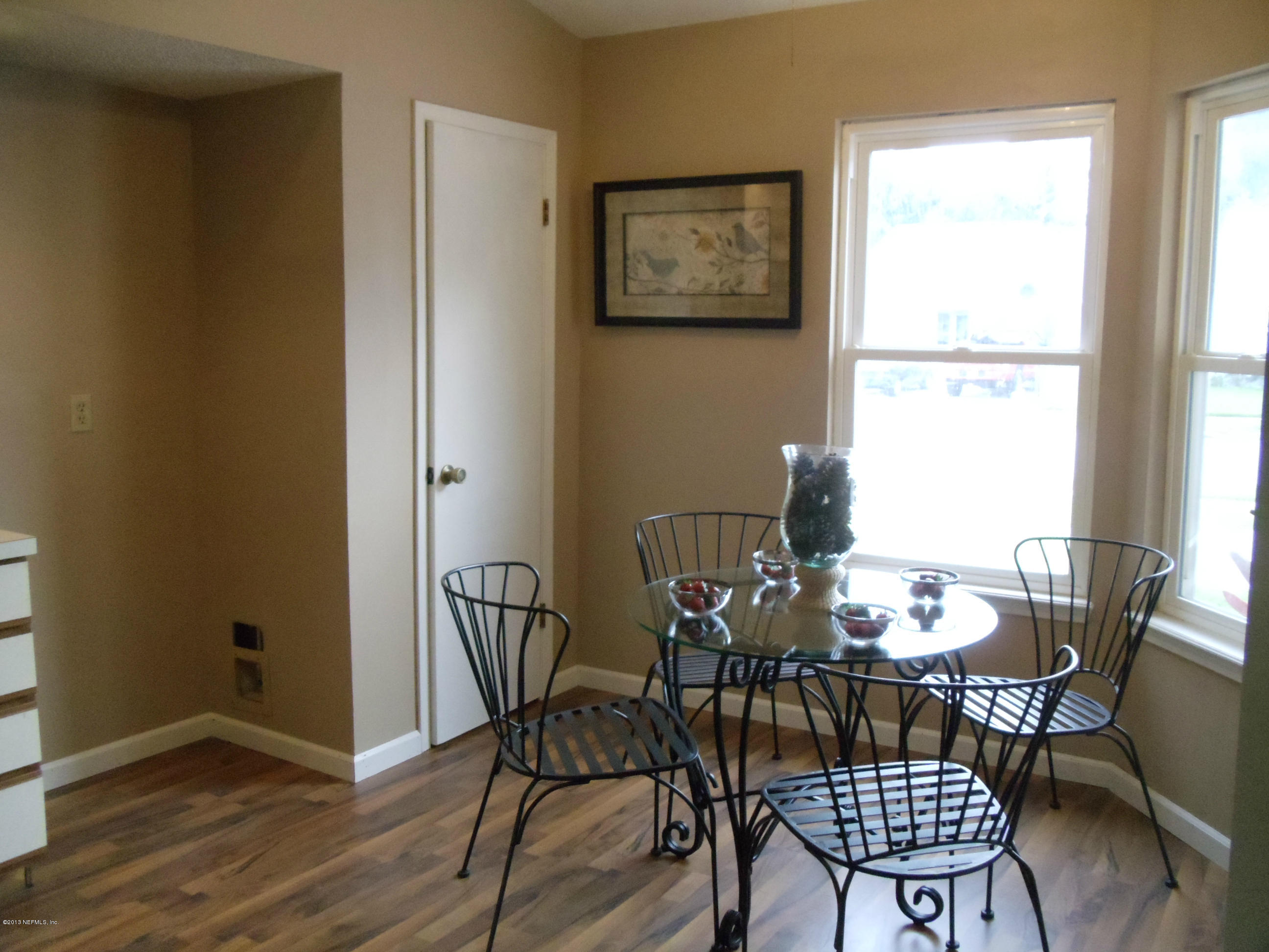 2462 Wattle Tree Road East Jacksonville, FL 32246 - Photo 9 of 35 a view of a dining room with furniture and wooden floor