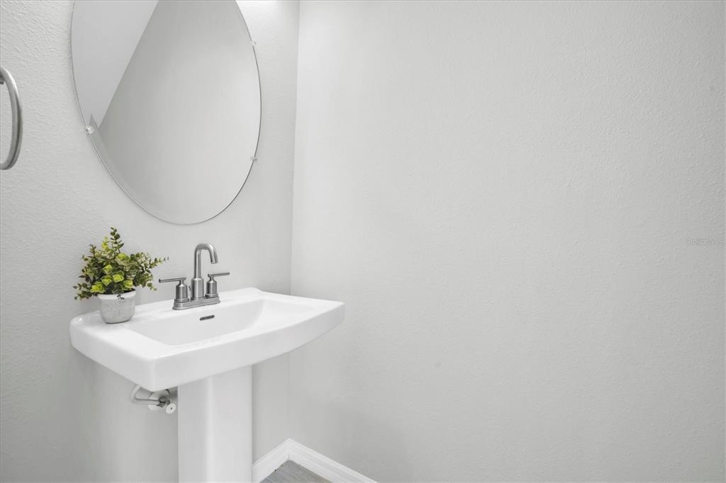 13639 Rangeland Boulevard Odessa, FL 33556 - Photo 15 of 63 a bathroom with a sink and a mirror