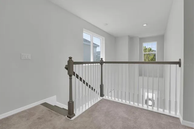 a bedroom with a bed and a lamp