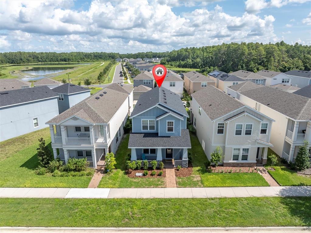 13639 Rangeland Boulevard Odessa, FL 33556 - Photo 2 of 63 a view of a big house with a big yard and potted plants