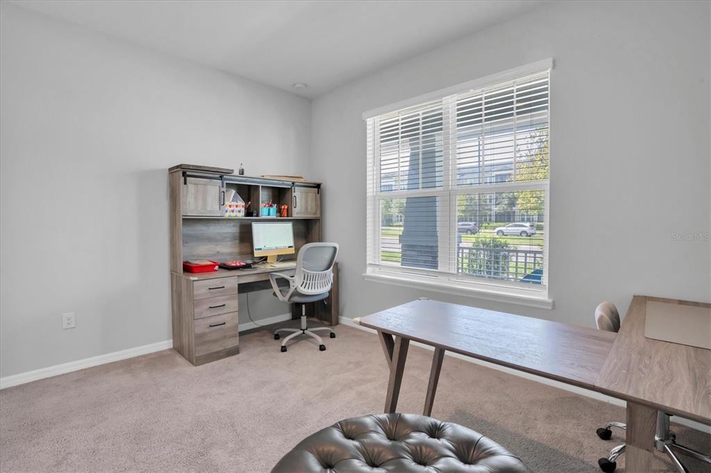 13639 Rangeland Boulevard Odessa, FL 33556 - Photo 28 of 63 a workspace with furniture and a window