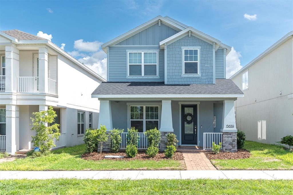 13639 Rangeland Boulevard Odessa, FL 33556 - Photo 39 of 63 a front view of a house with a yard