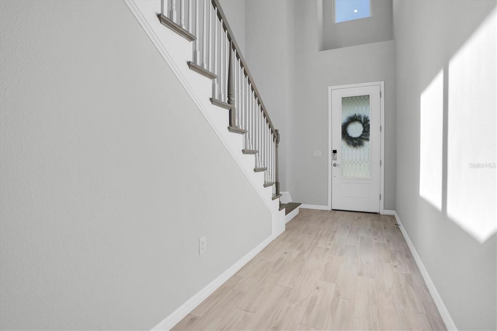 13639 Rangeland Boulevard Odessa, FL 33556 - Photo 5 of 63 a view of entryway with stairs