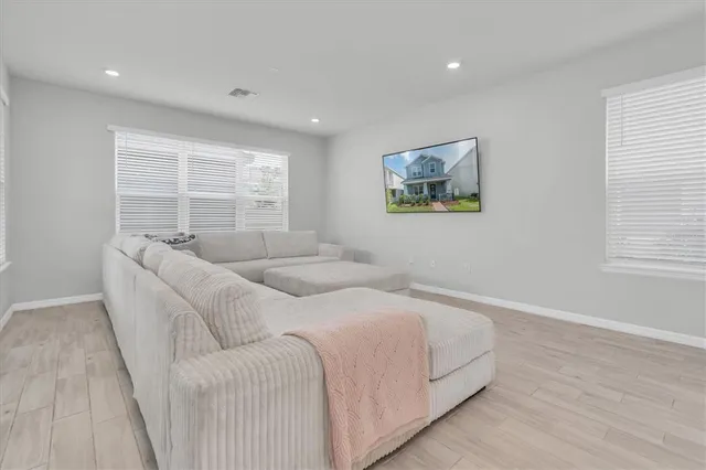 a kitchen with stainless steel appliances kitchen island granite countertop a sink a stove and cabinets