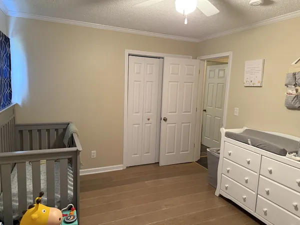 a view of a bedroom with closet area