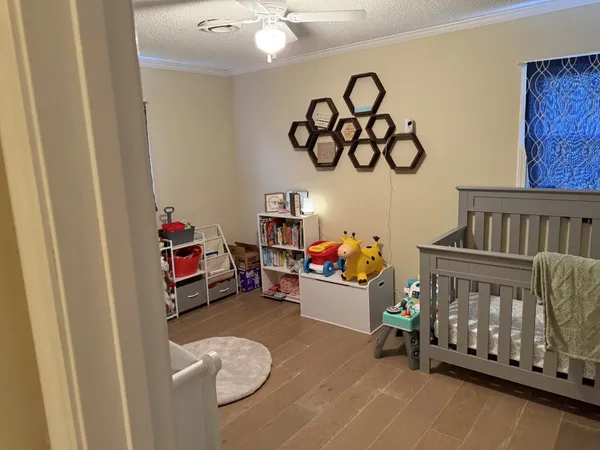 a bedroom with baby toys and stairs