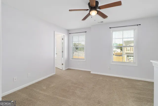 a view of an empty room with a window