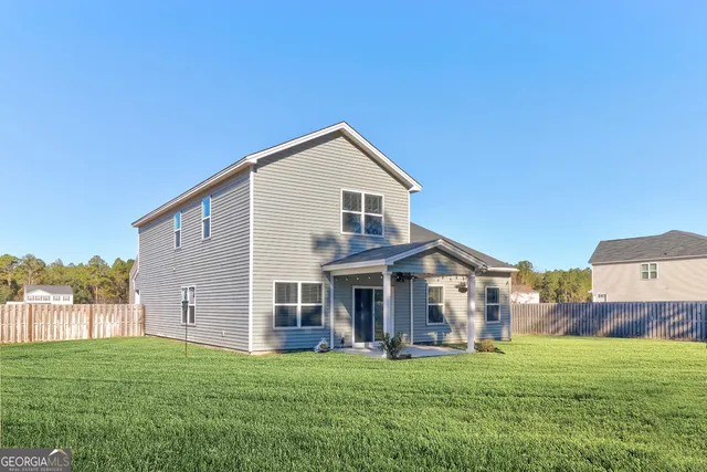 a front view of a house with a garden and porch