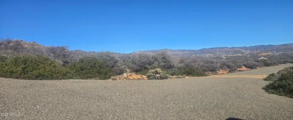 a view of a road with a mountain in the background