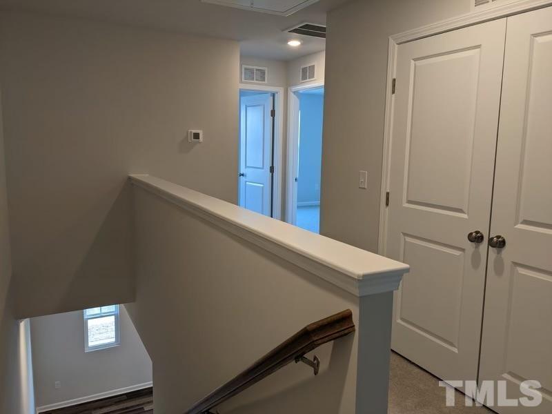 205 Nahunta Drive Apex, NC 27539 - Photo 11 of 24 a view of a hallway with closet