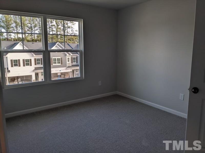 205 Nahunta Drive Apex, NC 27539 - Photo 13 of 24 an empty room with a window