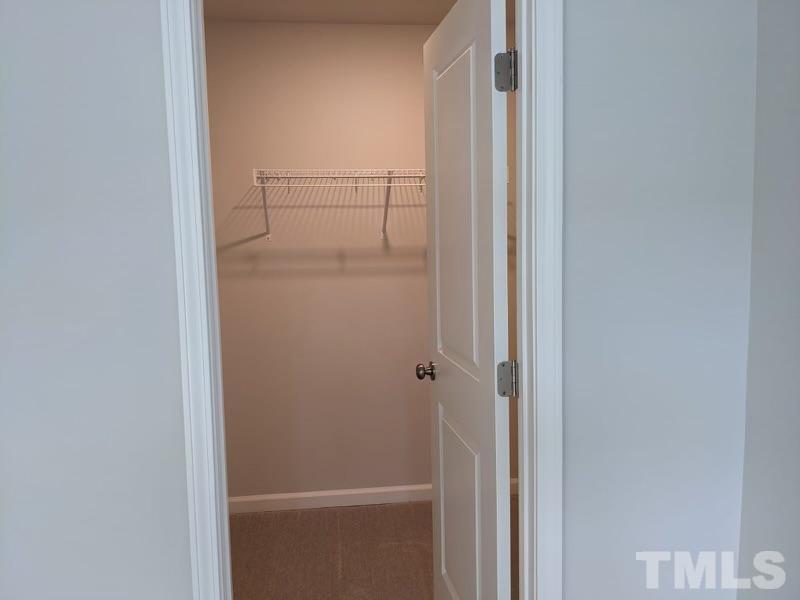 205 Nahunta Drive Apex, NC 27539 - Photo 14 of 24 a bathroom with a glass shower door