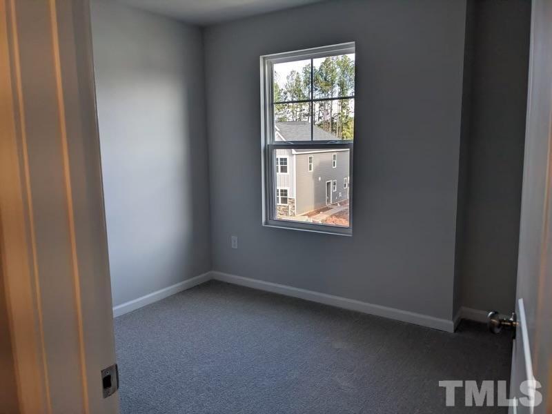 205 Nahunta Drive Apex, NC 27539 - Photo 15 of 24 an empty room with windows