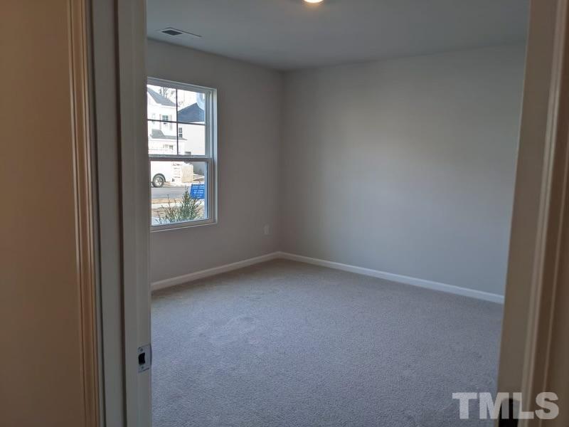 205 Nahunta Drive Apex, NC 27539 - Photo 17 of 24 an empty room with windows