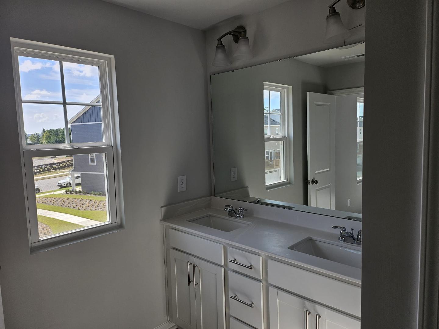 205 Nahunta Drive Apex, NC 27539 - Photo 18 of 24 a bathroom with a sink and a mirror