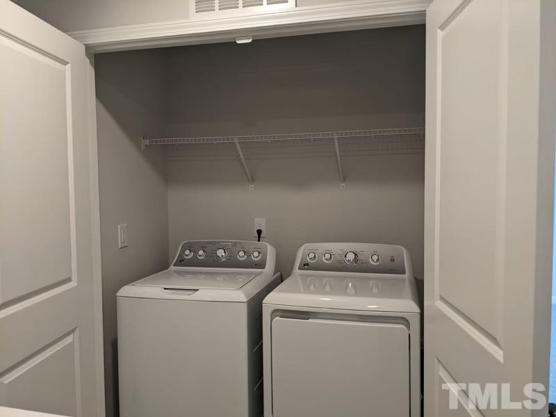 205 Nahunta Drive Apex, NC 27539 - Photo 20 of 24 a utility room with dryer and washer