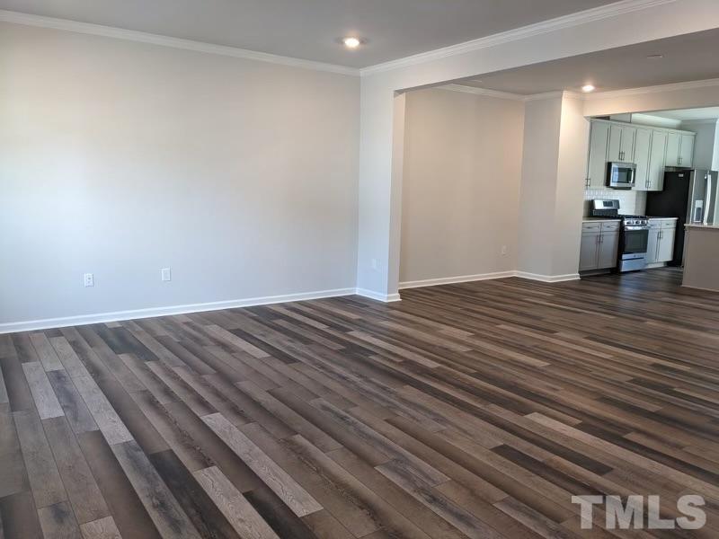 205 Nahunta Drive Apex, NC 27539 - Photo 2 of 24 a view of a room with wooden floor