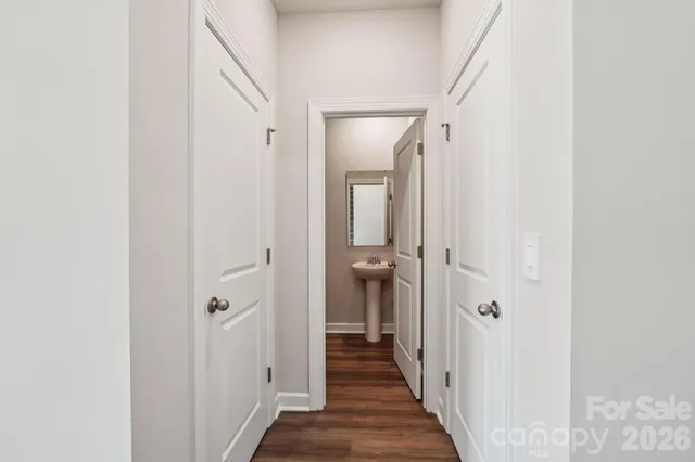 a view of a bathroom from a hallway