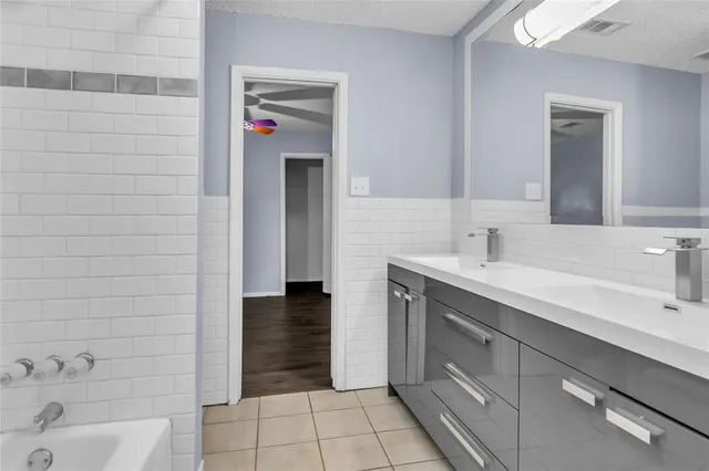 a bathroom with a sink and a shower