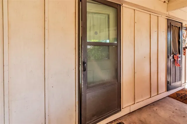 a bathroom with a glass shower door