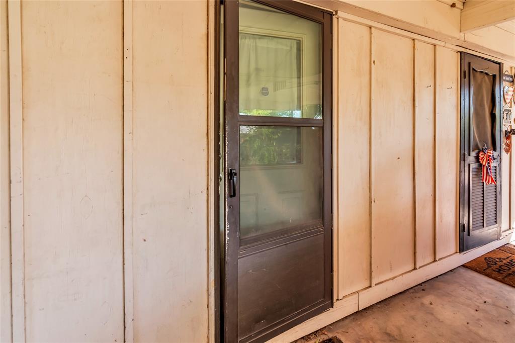 805 Irwin Drive, Unit B Hurst, TX 76053 - Photo 25 of 26 a bathroom with a glass shower door