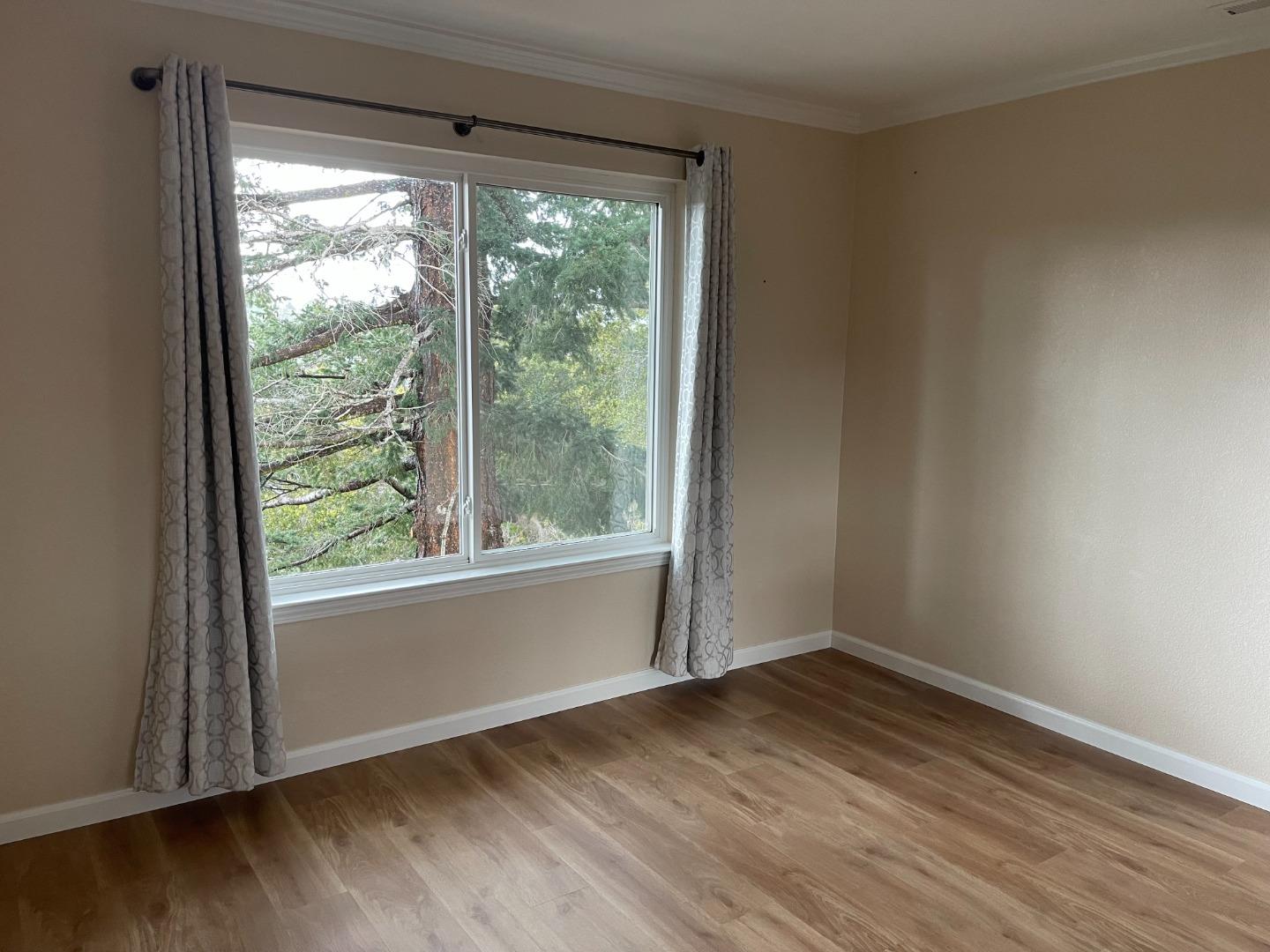 2625 Sequoia Way Belmont, CA 94002 - Photo 12 of 18 a view of empty room with wooden floor and a window