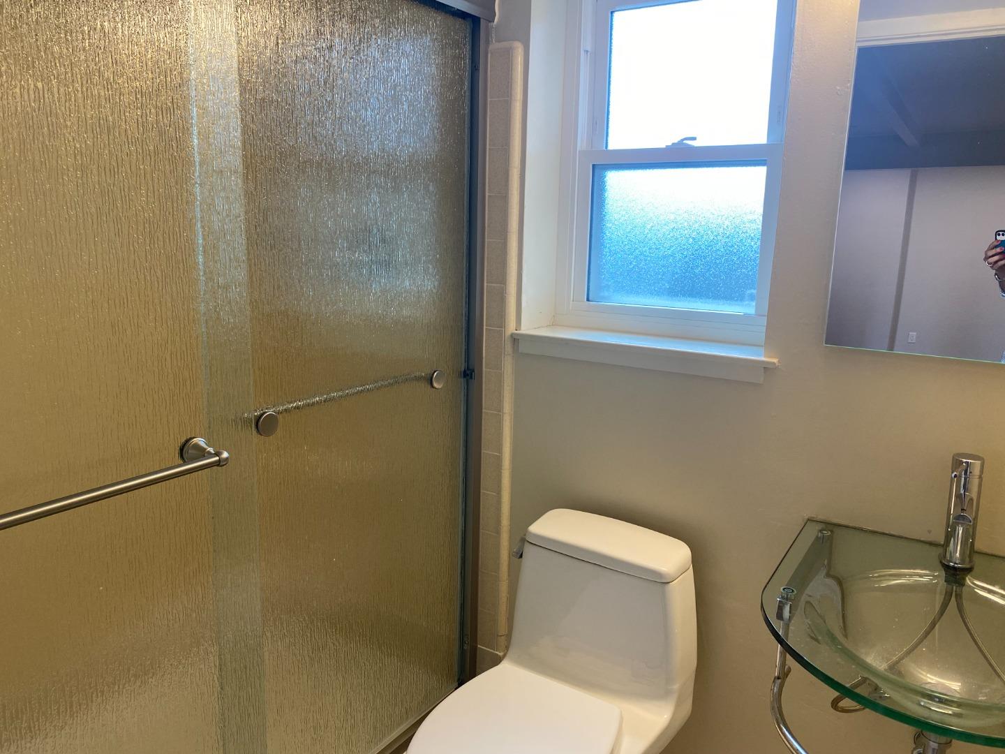 2625 Sequoia Way Belmont, CA 94002 - Photo 14 of 18 a white toilet sitting next to a bathroom sink