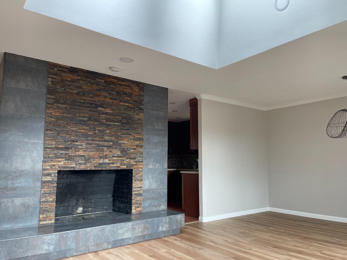 2625 Sequoia Way Belmont, CA 94002 - Photo 4 of 18 a view of empty room with wooden floor and fireplace