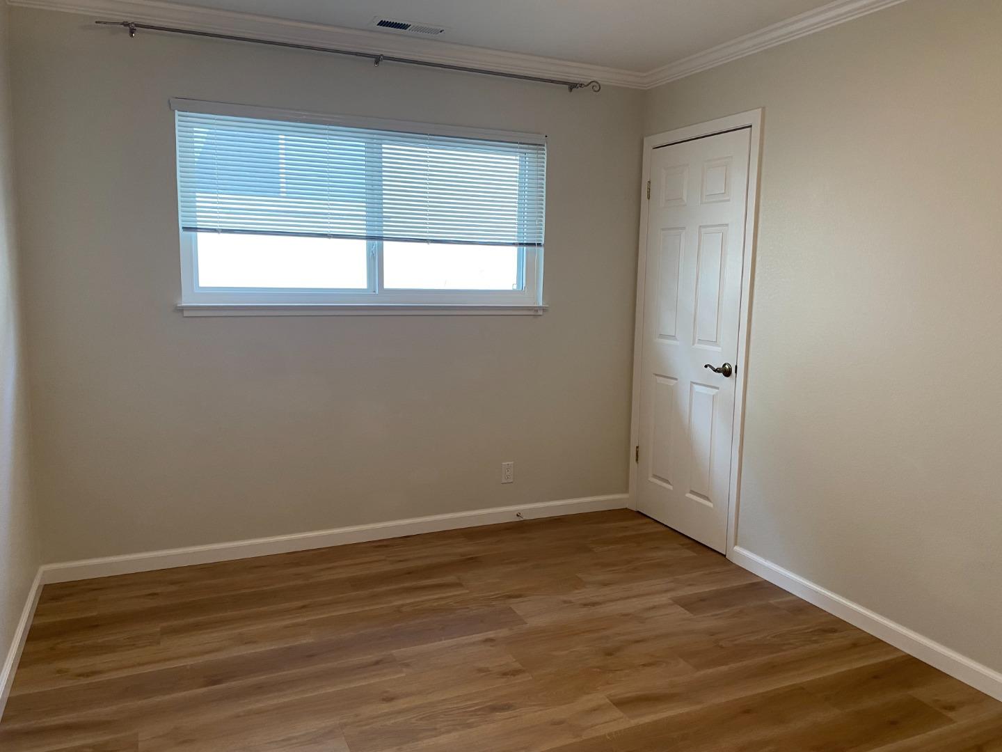 2625 Sequoia Way Belmont, CA 94002 - Photo 8 of 18 wooden floor in an empty room with a window