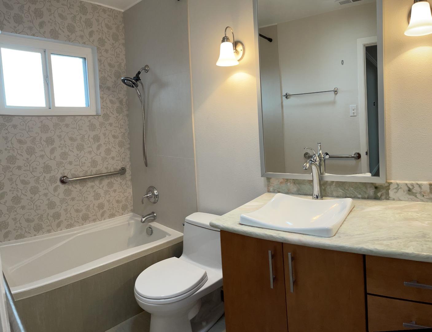 2625 Sequoia Way Belmont, CA 94002 - Photo 9 of 18 a bathroom with a sink a toilet and shower