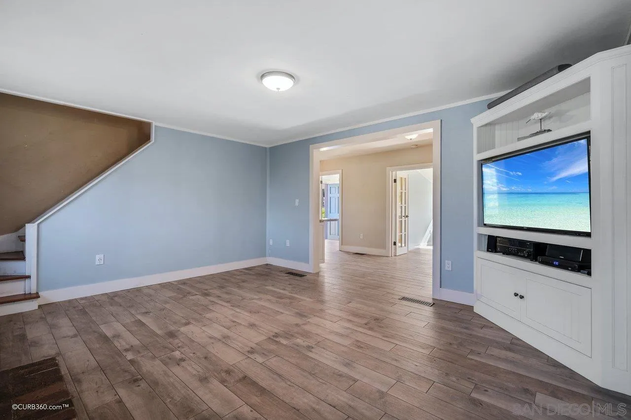 1544 Grove Road El Cajon, CA 92020 - Photo 11 of 42 a view of an empty room with wooden floor and windows