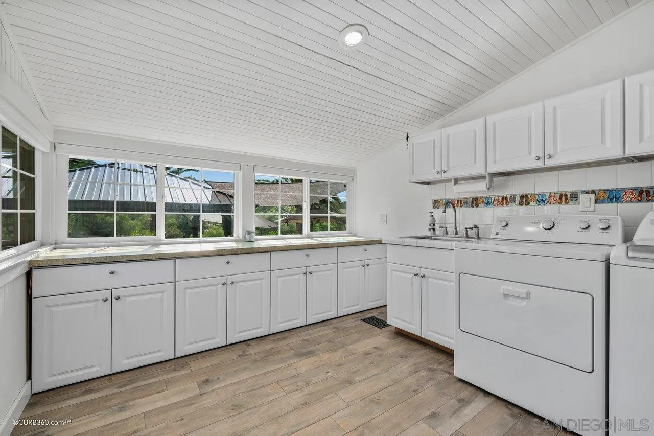 1544 Grove Road El Cajon, CA 92020 - Photo 20 of 42 a kitchen with cabinets stainless steel appliances and window