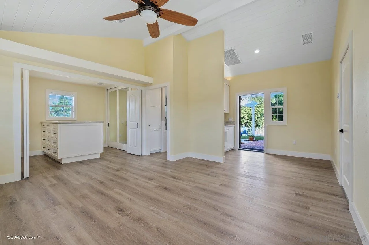 1544 Grove Road El Cajon, CA 92020 - Photo 26 of 42 an empty room with wooden floor and windows