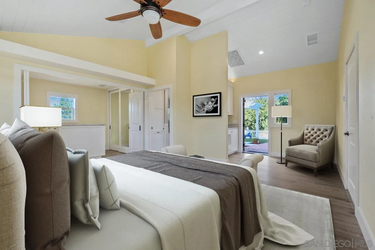 1544 Grove Road El Cajon, CA 92020 - Photo 27 of 42 a bedroom with a bed couch and a window