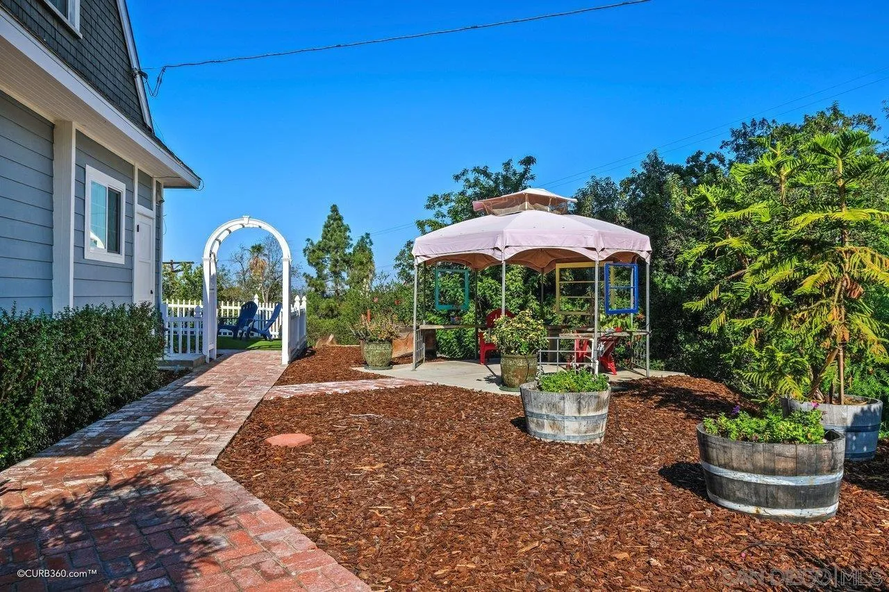 1544 Grove Road El Cajon, CA 92020 - Photo 6 of 42 a view of a patio with a table and chairs under an umbrella