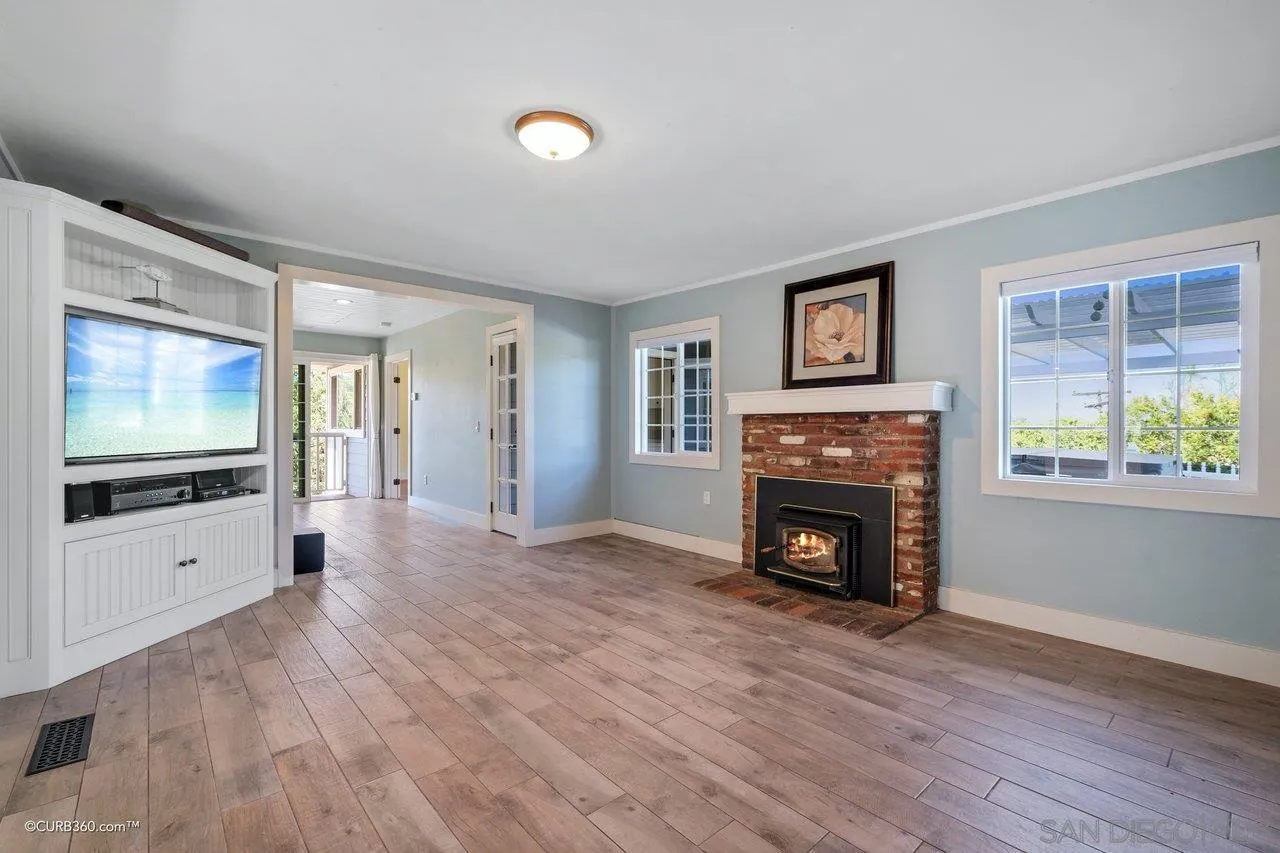 1544 Grove Road El Cajon, CA 92020 - Photo 9 of 42 a view of living room with furniture fireplace and wooden floor