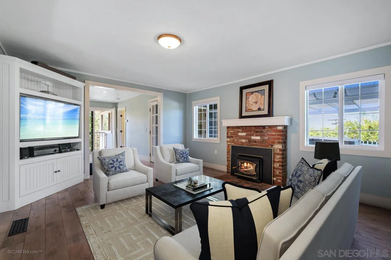 1544 Grove Road El Cajon, CA 92020 - Photo 10 of 42 a living room with furniture a flat screen tv and a fireplace