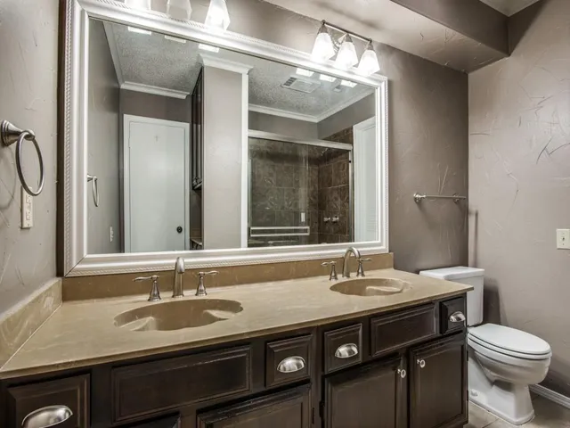 a bathroom with a sink and a toilet