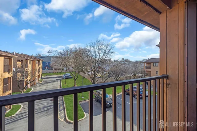 a view of a balcony with wooden fence and floor