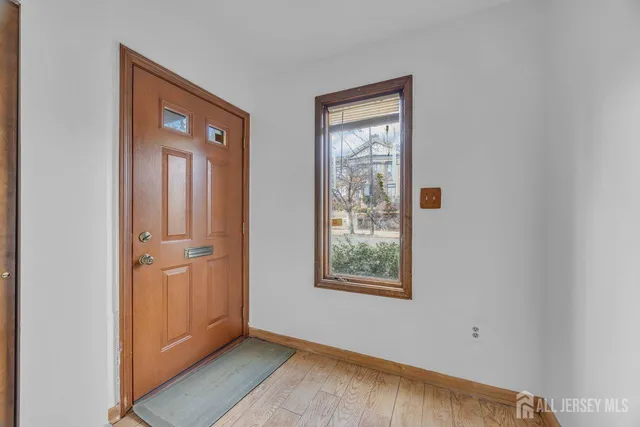 a view of entryway with wooden floor