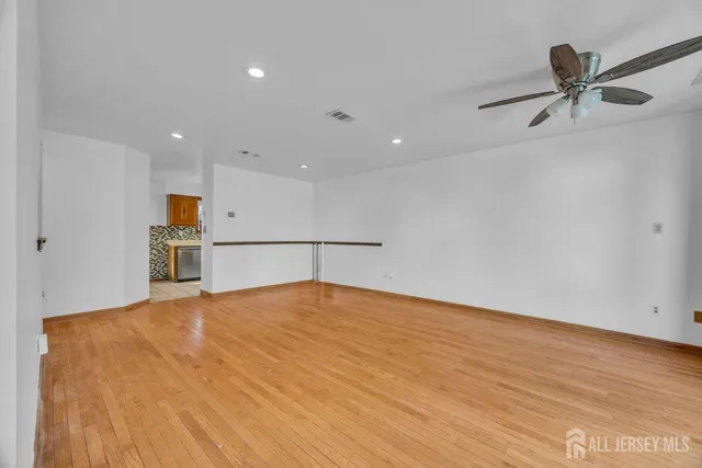 a utility room with cabinets washer and dryer