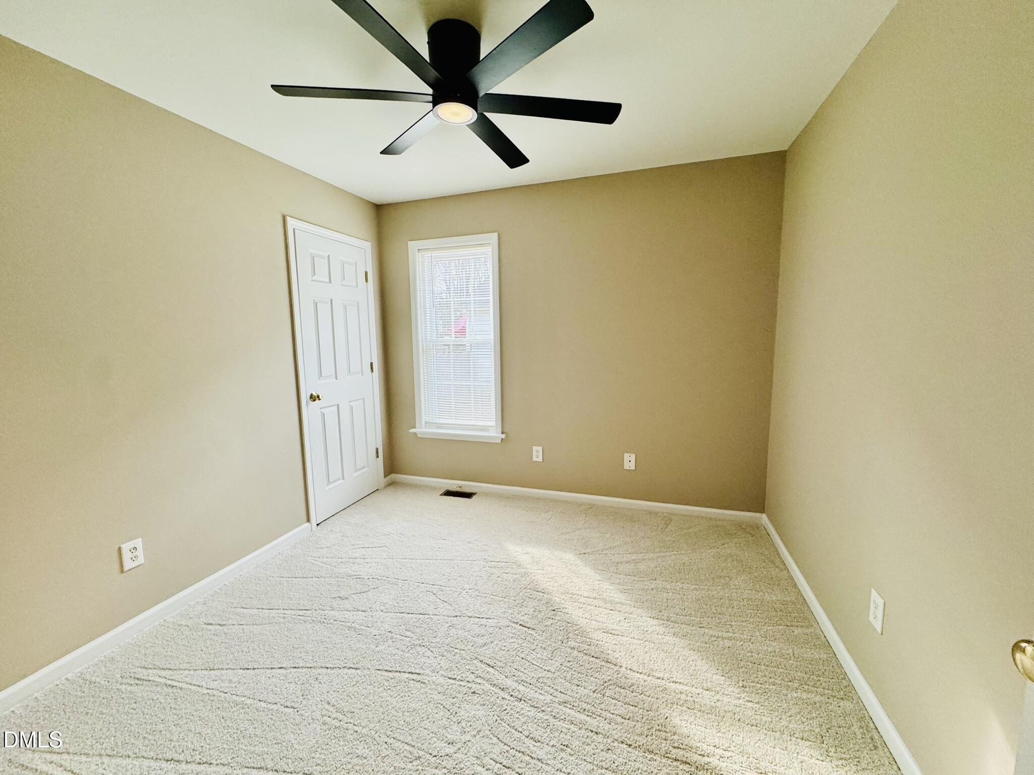 6904 Fox Haven Place Raleigh, NC 27616 - Photo 11 of 17 an empty room and chandelier fan