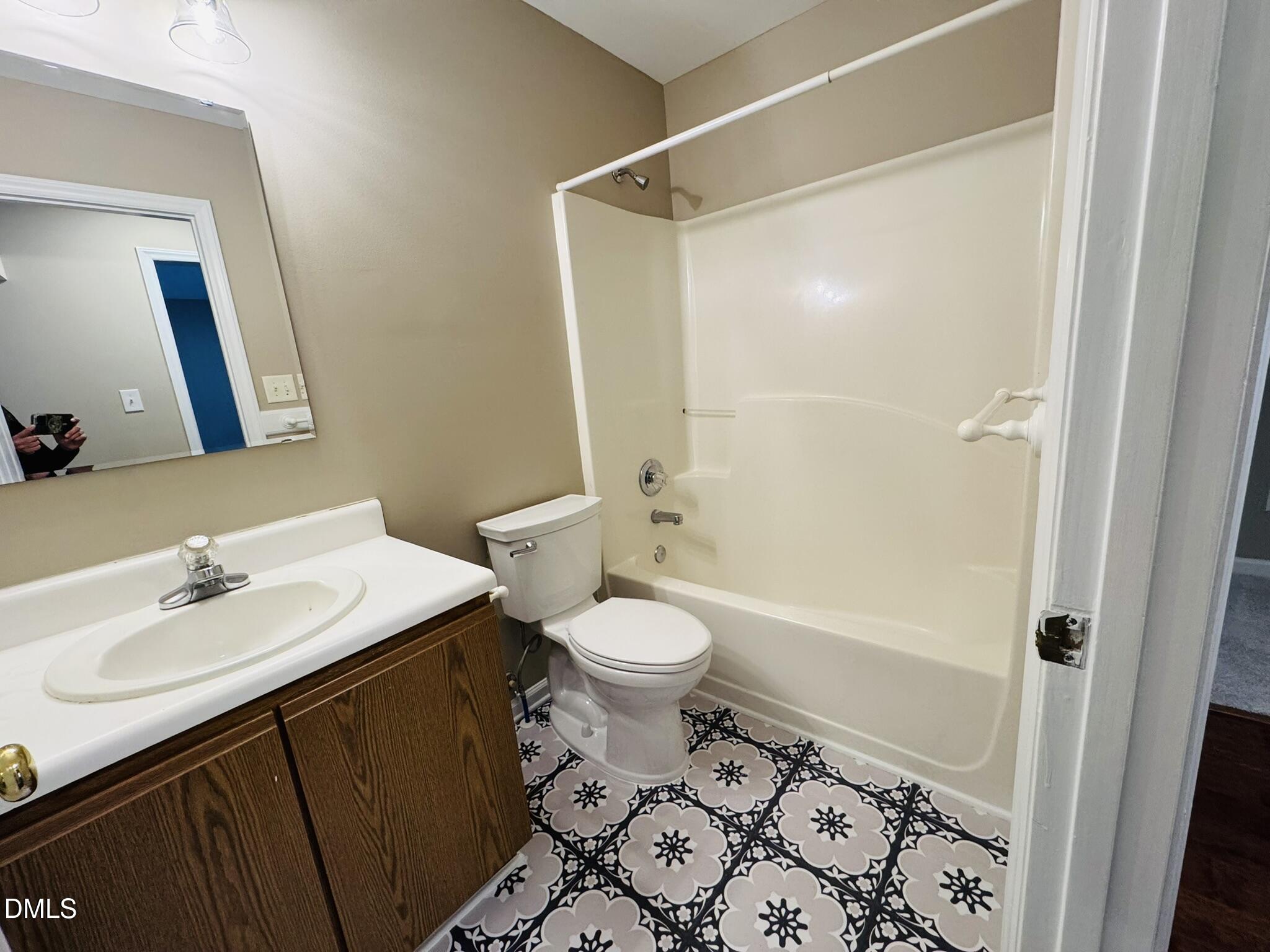 6904 Fox Haven Place Raleigh, NC 27616 - Photo 12 of 17 a bathroom with a sink toilet and shower