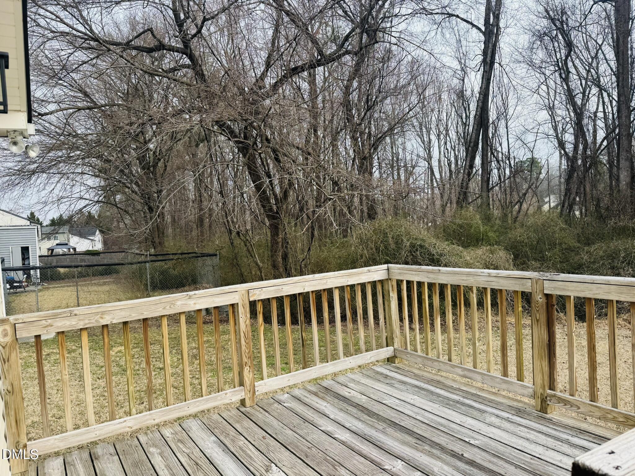6904 Fox Haven Place Raleigh, NC 27616 - Photo 17 of 17 a balcony with wooden floor and fence