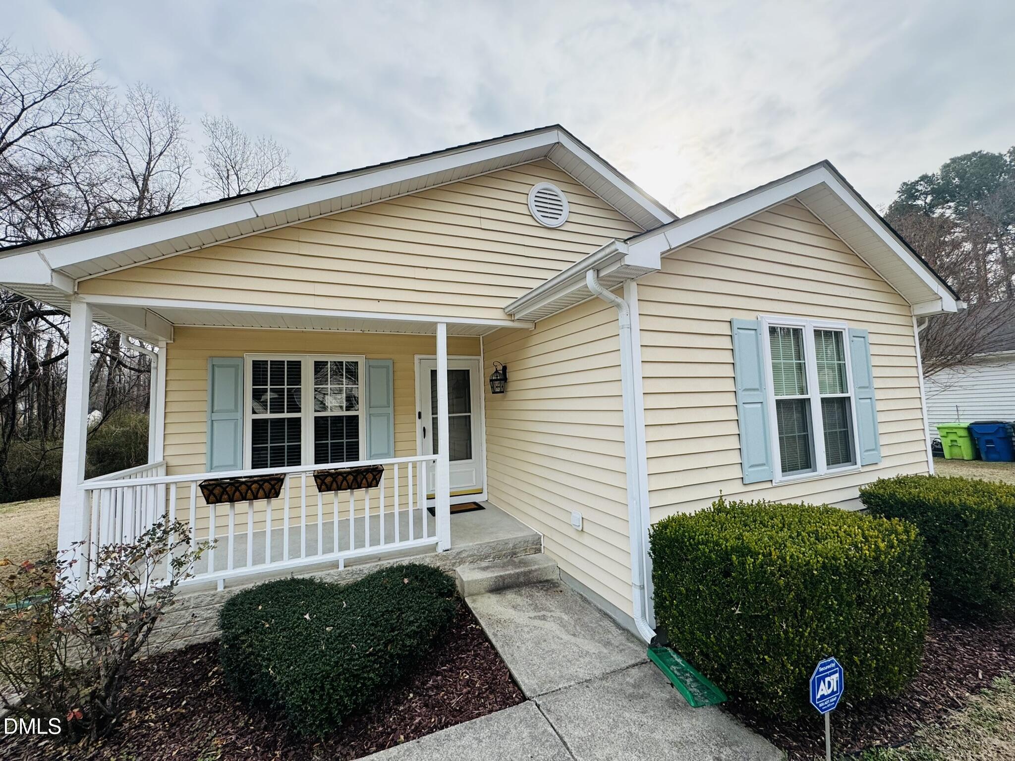 6904 Fox Haven Place Raleigh, NC 27616 - Photo 2 of 17 front view of a house with a small yard