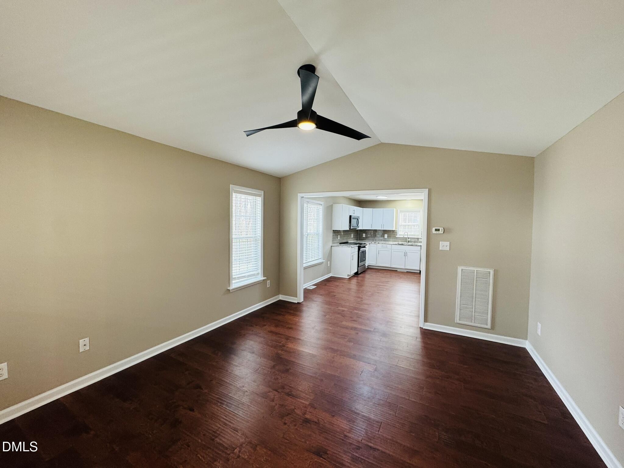 6904 Fox Haven Place Raleigh, NC 27616 - Photo 3 of 17 a view of empty room with wooden floor and window
