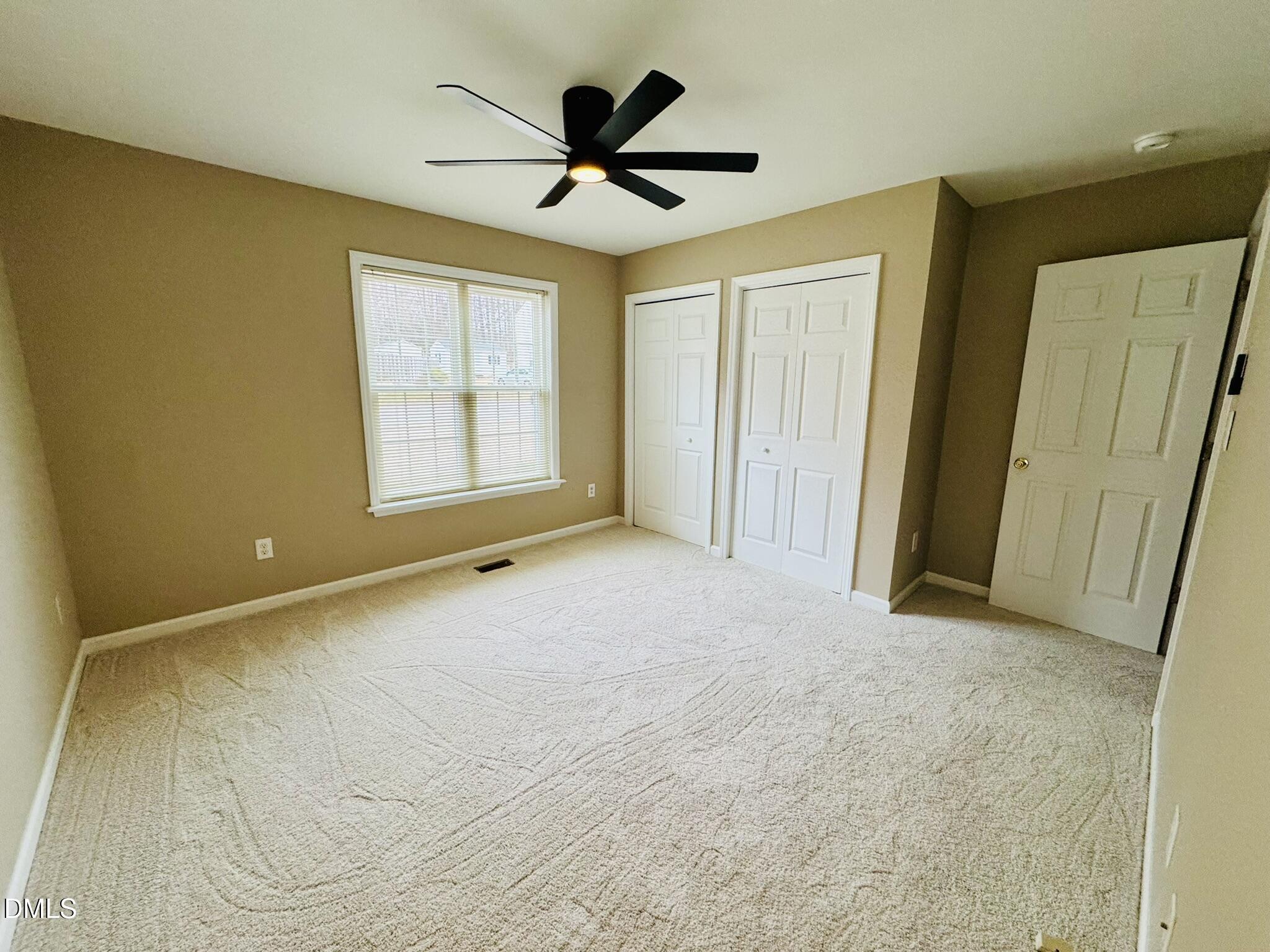 6904 Fox Haven Place Raleigh, NC 27616 - Photo 9 of 17 a view of an empty room with a window
