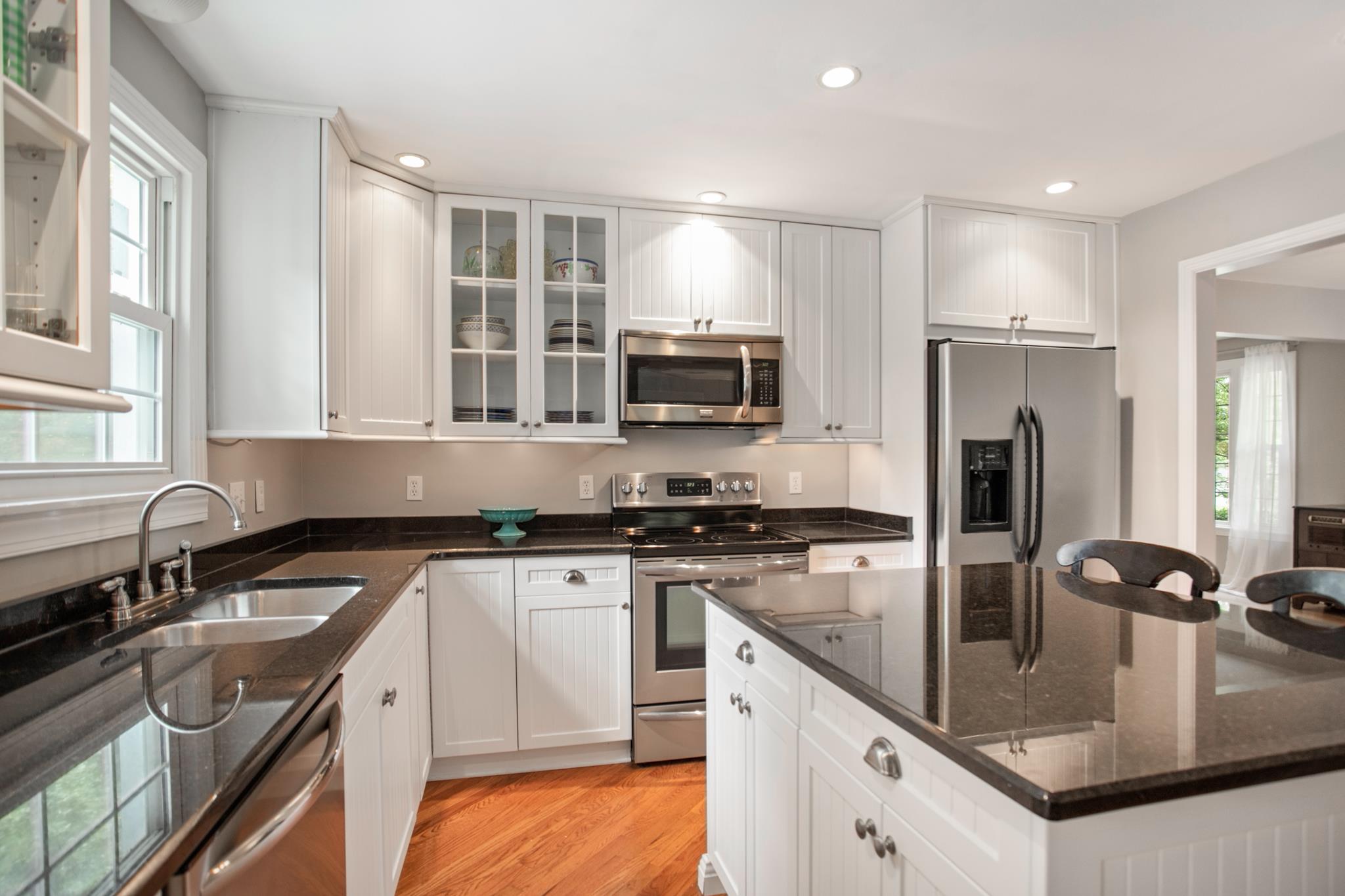 608 Crieve Road Nashville, TN 37220 - Photo 12 of 23 Granite countertops, under cabinet lighting, and stainless steel appliances